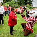 Photo of Bucky Badger welcoming Donna Shalala back to Olin House, the official residence of the chancellor, during a tailgate party Sept. 8. Shalala, who served as chancellor from 1988 to 1993, returned to campus for her induction into the UW Athletic Hall of Fame.