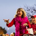 Lori Reesor, vice chancellor of student affairs, and Argyle Wade, interim Dean of Students, wave to the crowd at the Homecoming Parade.