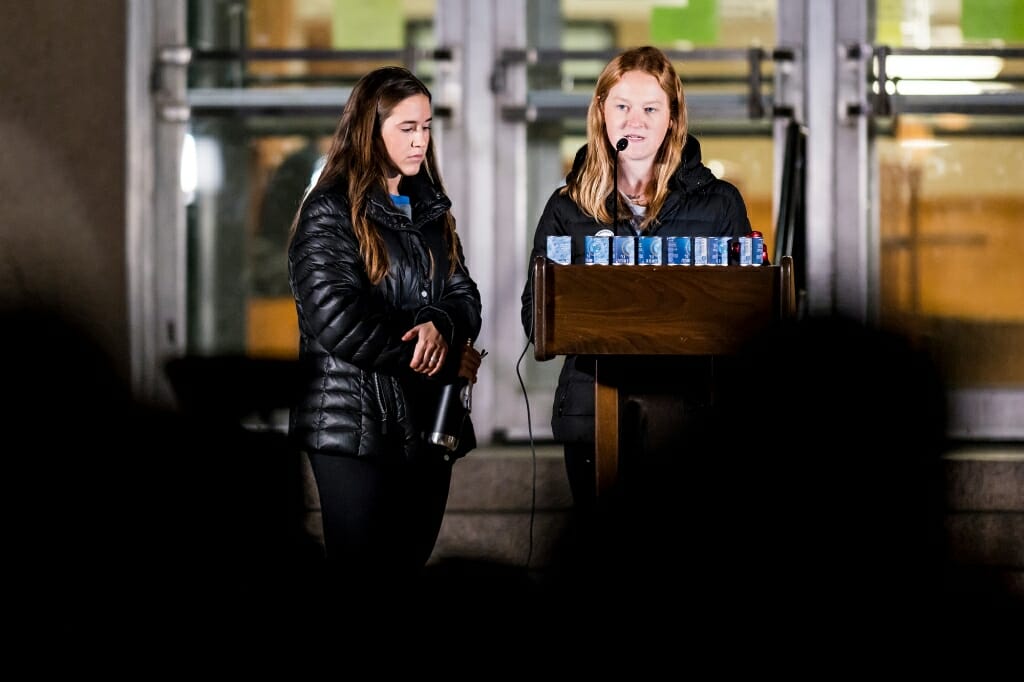 Photo of Olivia O'Connor, a student from Pittsburgh, reading the names of the 11 victims.