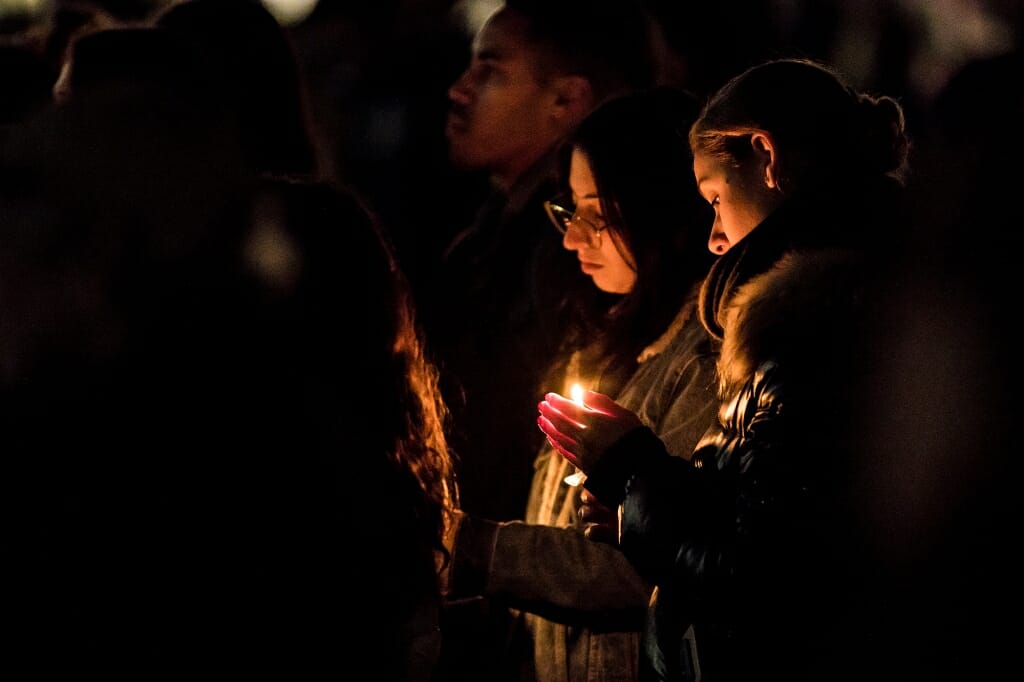 Photo of students holding candles.