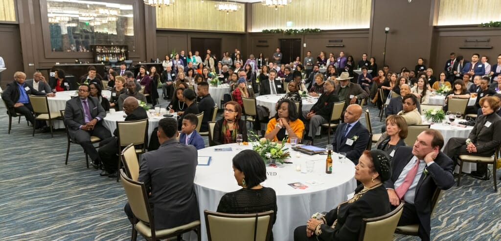 Photo: Attendees sitting at tables