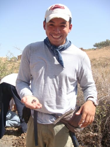Photo: Carlos Santibáñez-Lópezholding a large-clawed scorpion