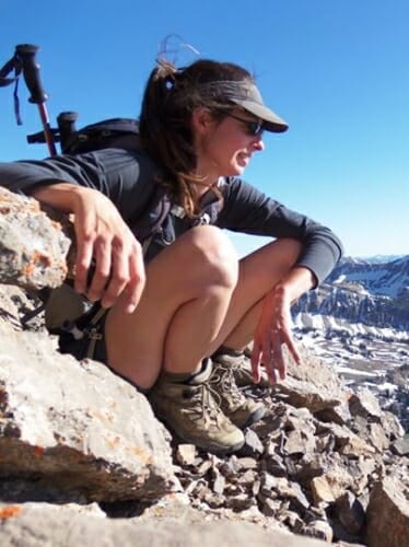 Photo: Jennifer McCabe sitting on a mountain