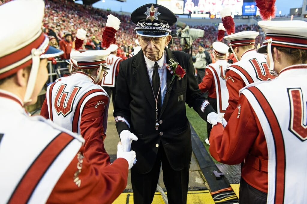 UW Band director Mike Leckrone shakes hands with members on Saturday.