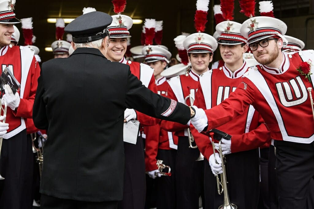 Leckrone shakes hands with members of the band before his final appearance at the UW Badger Bash at Union South, before the game.