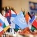 Photo: A collection of small international flags on top of a table