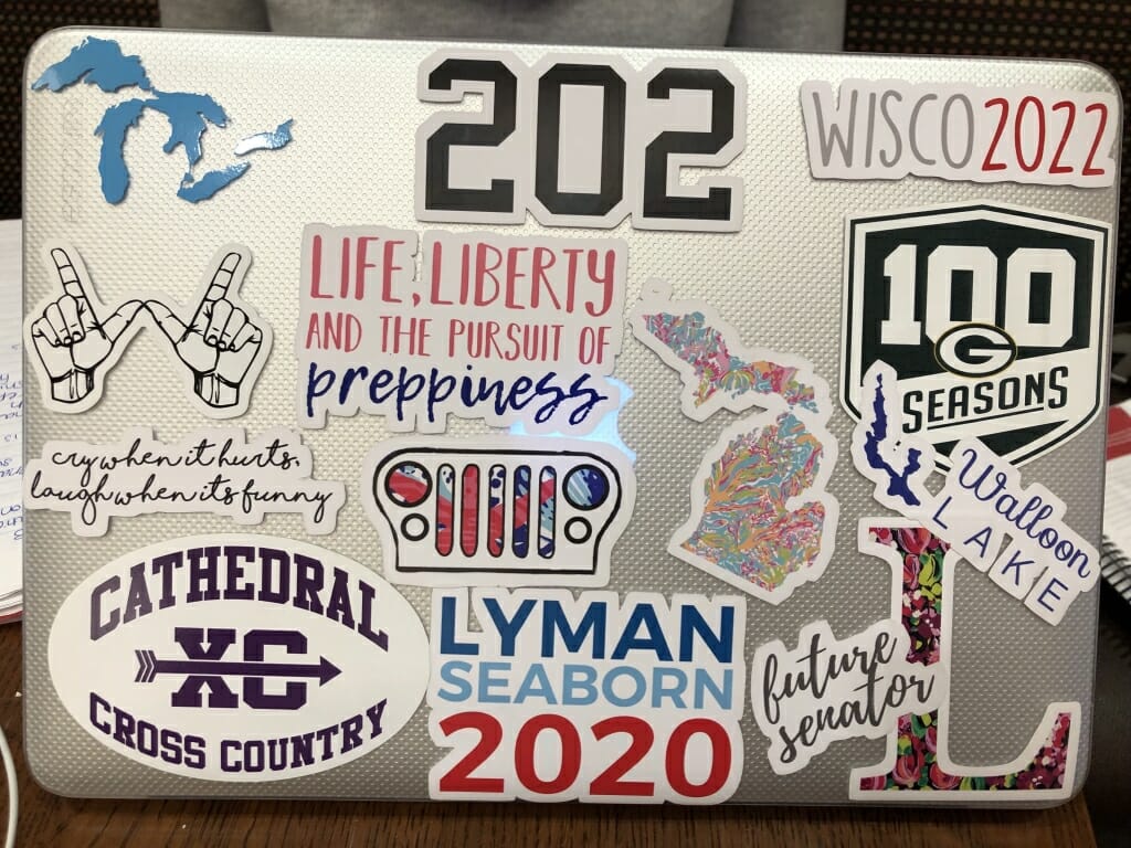 Freshman Lilly Freemyer's laptop, which features a Great Lakes sticker, a Michigan sticker, one that says "future senator," and a Green Bay Packers sticker, among others