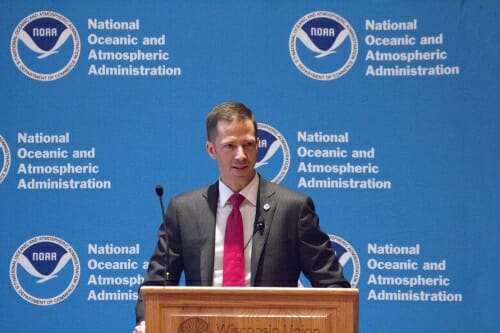 Neil Jacobs speaking at a podium.
