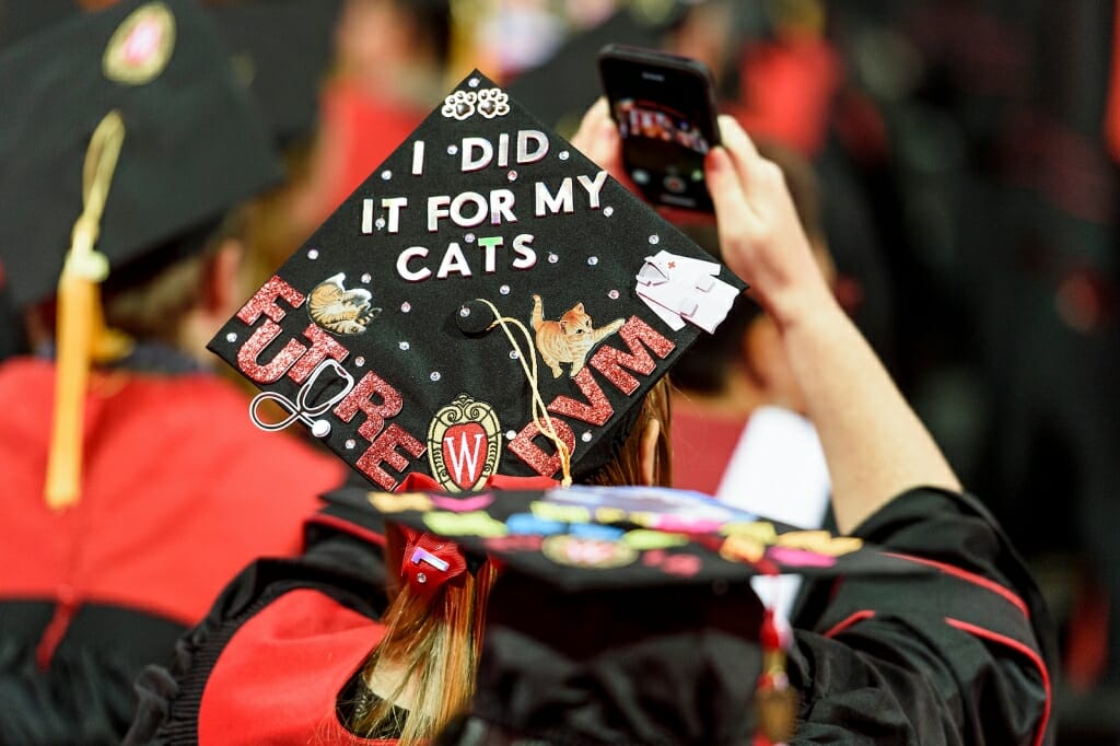 Photo of mortarboard reading, "I did it for my cats - future DVM"