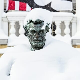 Photo: A snowy Abraham Lincoln statue.