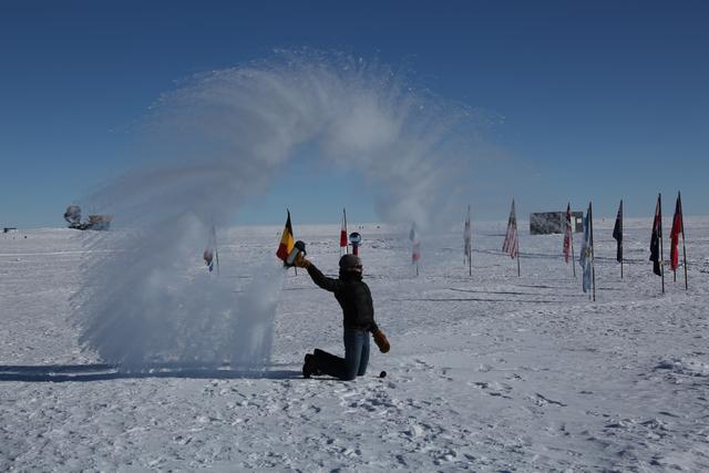 Photo: UW–Madison scientist Delia Tosi throwing hot water into the air, where it immediately freezes, in January, 2016.