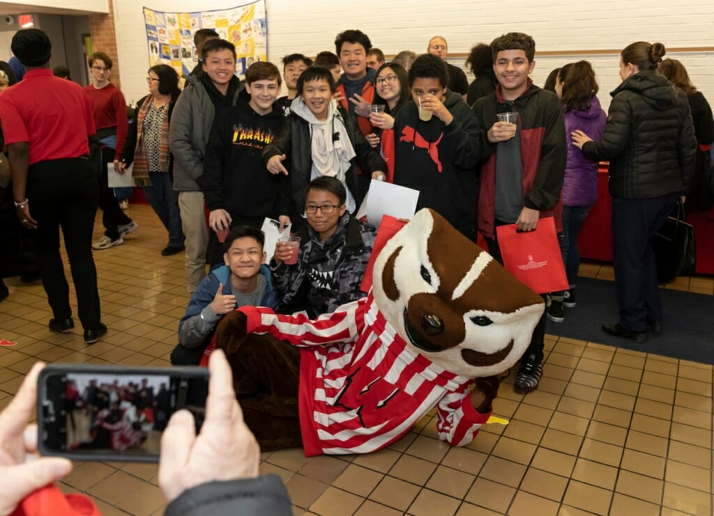Photo: Bucky and students pose for a photo.