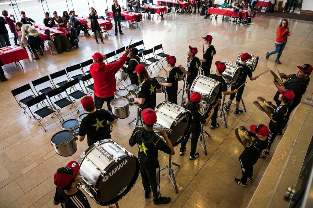 Black Star Drum Line, a Madison-youth performing arts group, plays during the ArtSpin event.