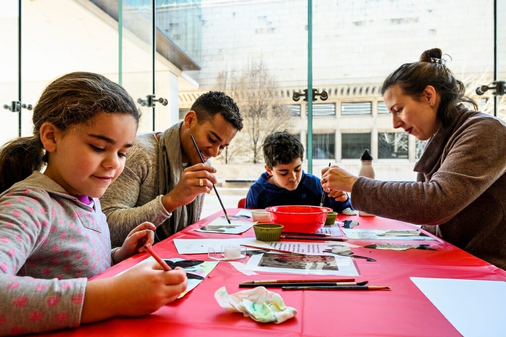 Yandri Delgado Villamil and Martina Kunović create art side by side with their children, Noa, 8, and Sammy, 10, Delgado Villamil is a staff member with UW-Madison's Facilities Planning and Management, and Kunović is a graduate student and instructor in sociology. 