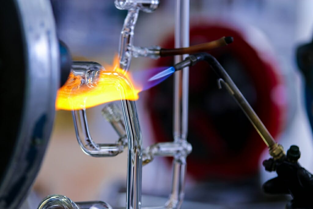 Photo: Closeup of flame and glass instrument