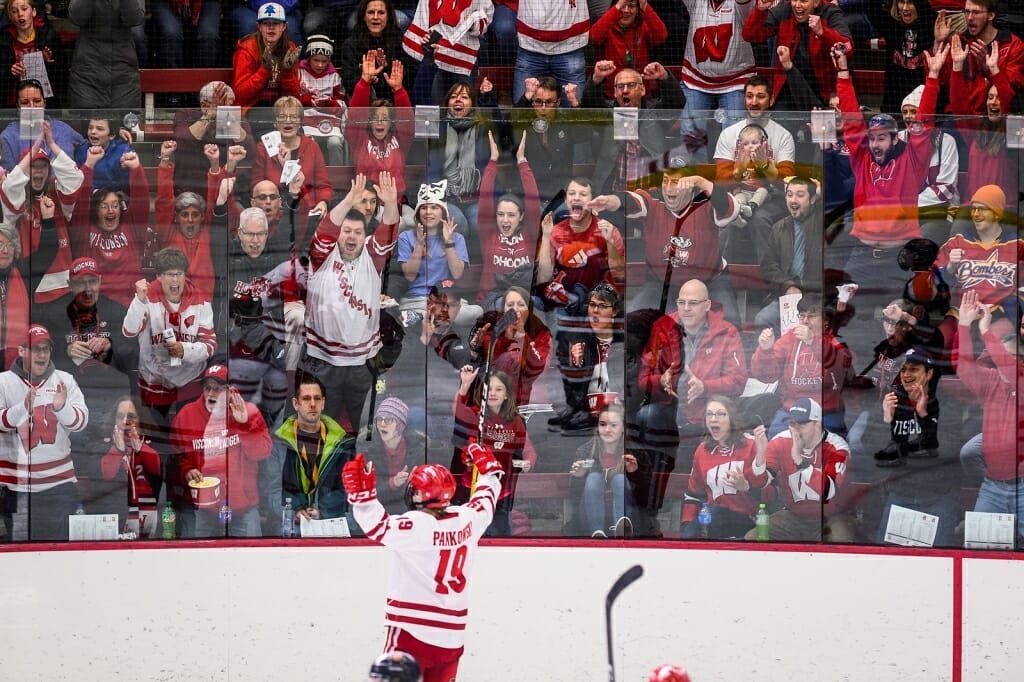 A sea of red-and-white clad Badger fans cheer Pankowski (19) after her first goal.