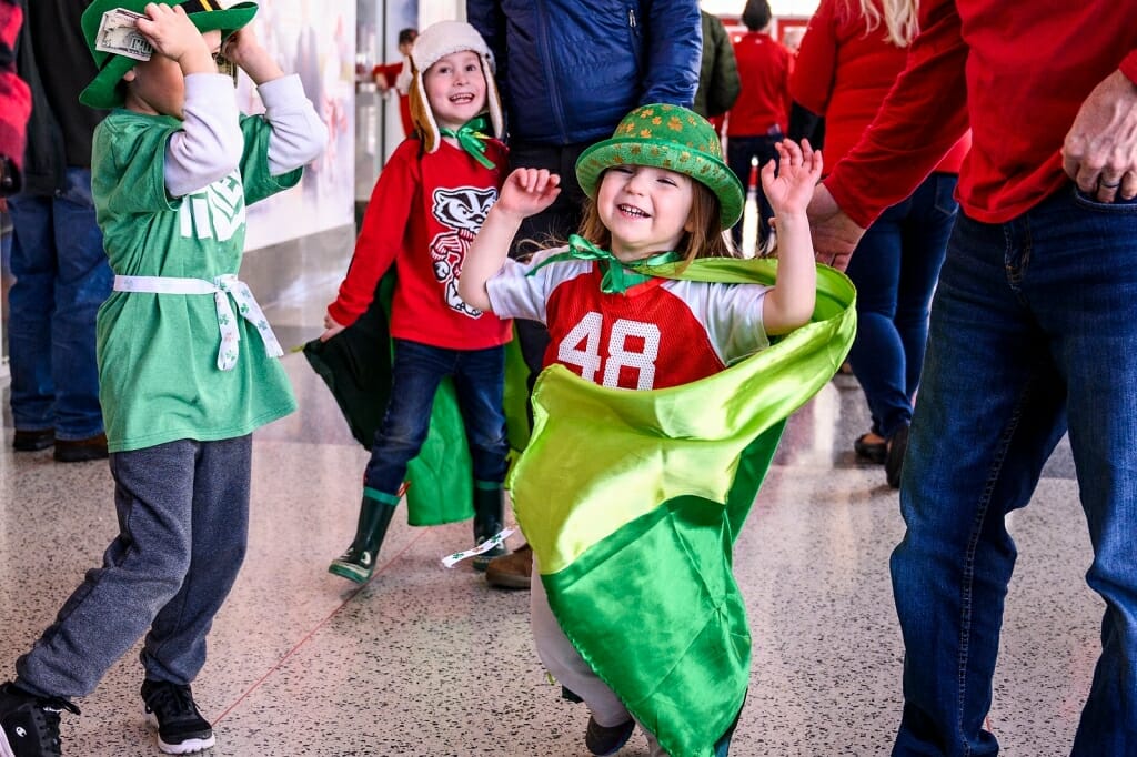 Feeling lucky, Badger fan MacKenzie Wheeler, 3, dons her St. Patrick's Day spirit for the game.