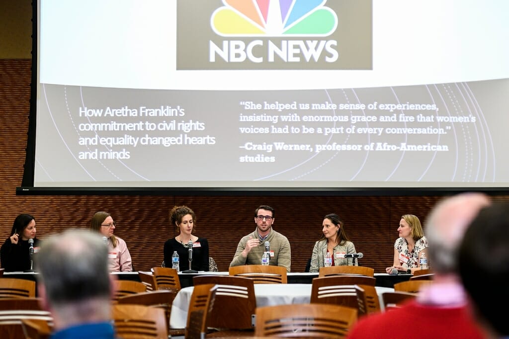 Photo: Panelists sitting at a table