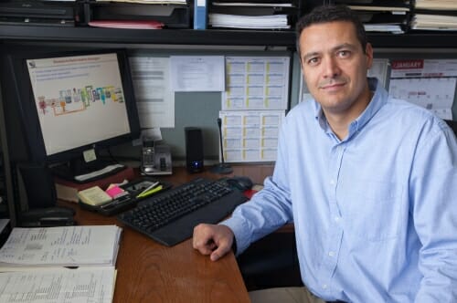 Photo of Christos Maravelias at his desk