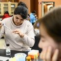 Photo: Students work carefully with samples.