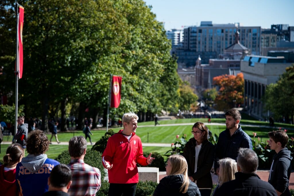 During an autumn tour, student guide Brandon Steer from Campus and Visitor Relations (CAVR), shows prospective students, family, and guests around campus at the top of Bascom Hill at the University of Wisconsin-Madison on Oct. 18, 2018. Visitors can see down State Street to the capitol building from the top of Bascom Hill.(Photo by Lauren Justice / UW-Madison)