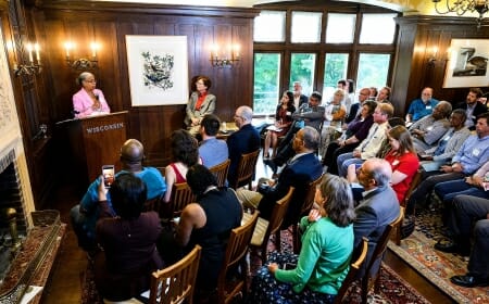 Photo of Gloria Ladson-Billings speaking at a podium to the audience at the Community University Partnership Awards.