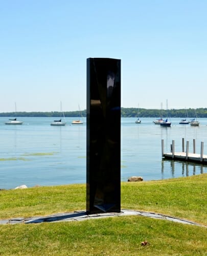 Photo: Sculpture standing on lakeshore