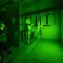 Photo: A lab is bathed in green light.