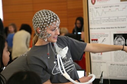 Photo: Person with net of sensors on head