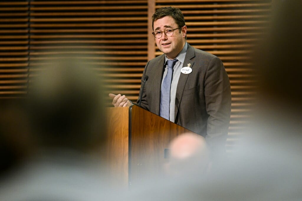 Photo: Laurent Heller speaks to a crowd.