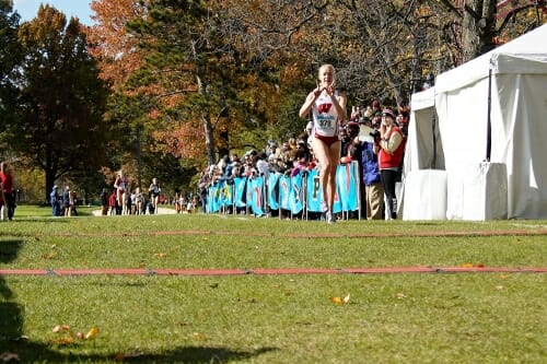 Photo: Alicia Monson running and flashing the W
