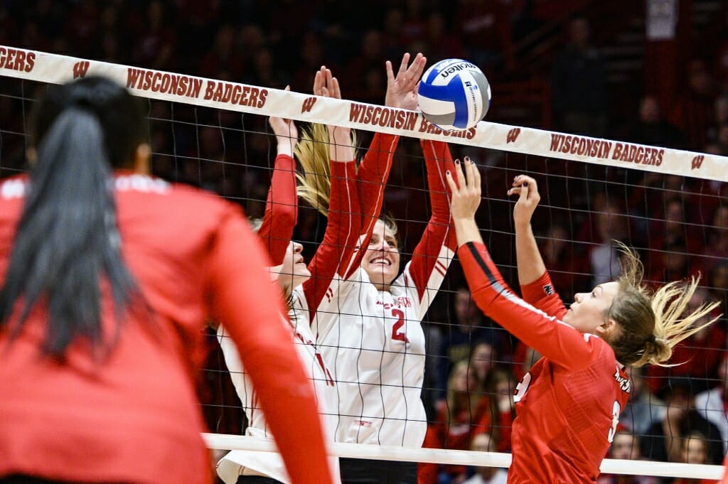 Photo: Grace Loberg (21) goes up for the block.