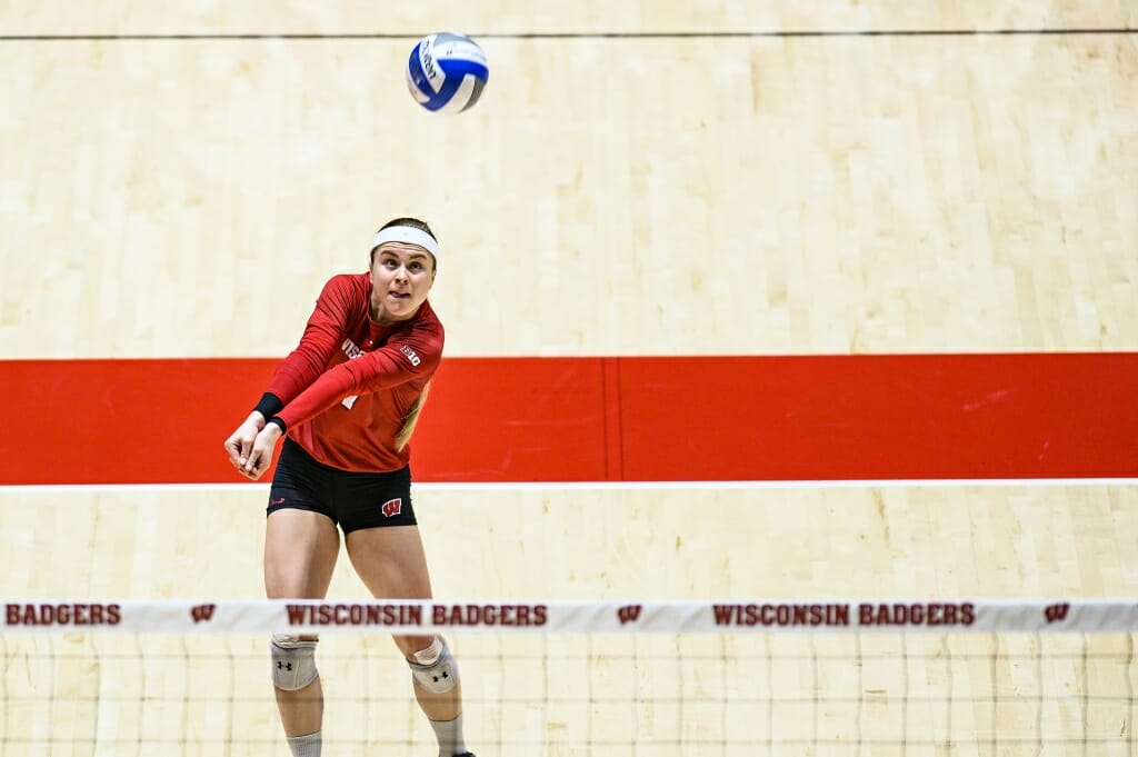 Photo: Tiffany Clark (17) digs the ball.