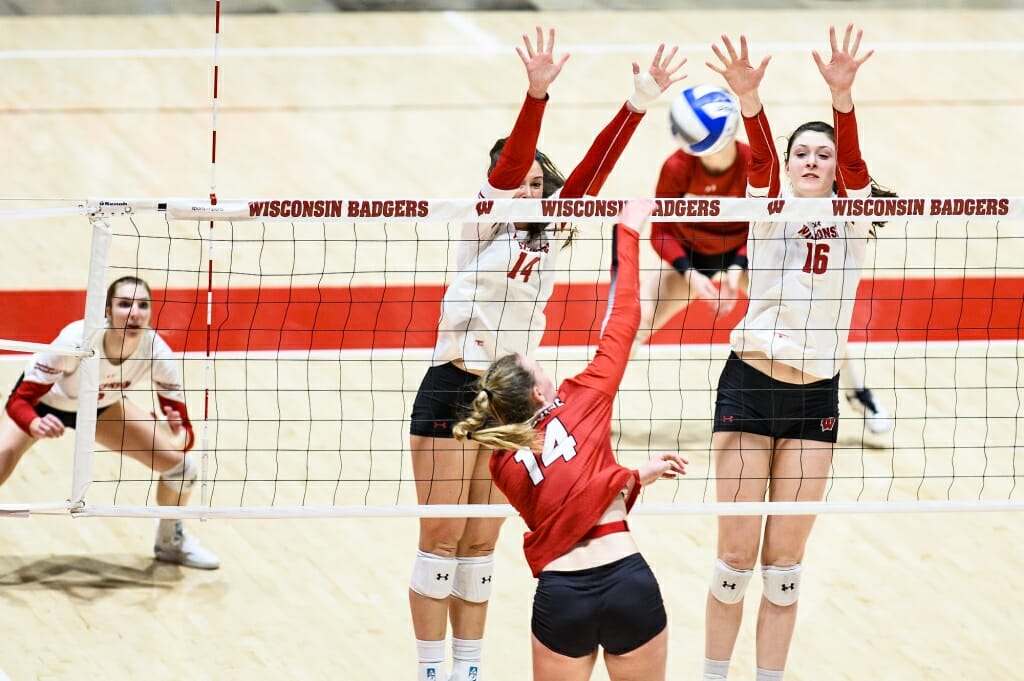 Photo: Madison Duello (14) and Dana Rettke (16) go up for the block.