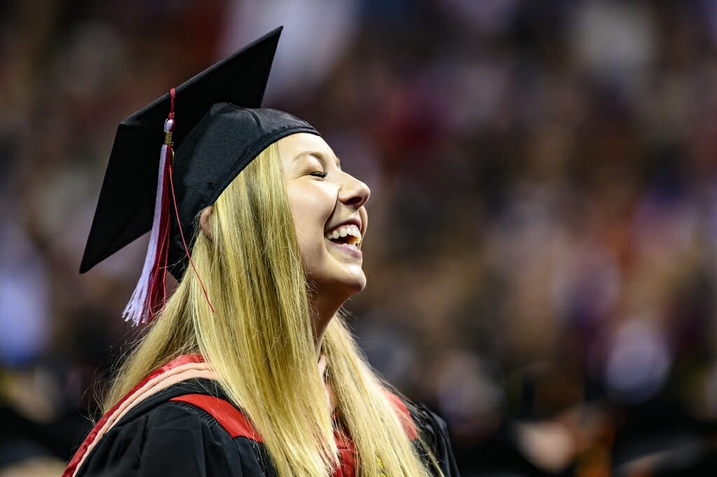 Photo of a young woman graduate smiling.