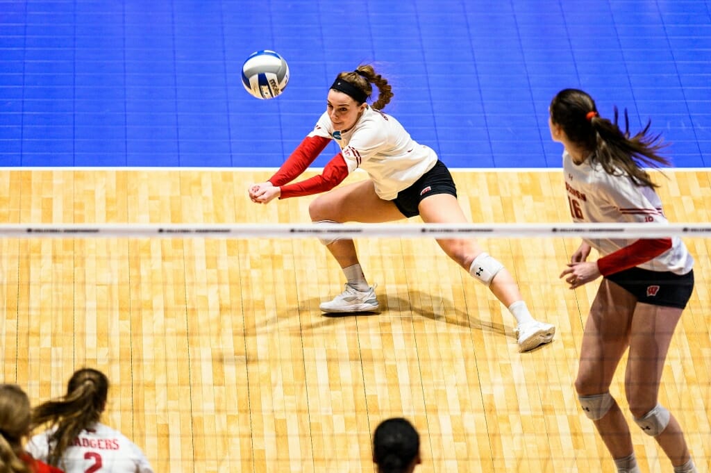 Photo: Wisconsin setter Izzy Ashburn (11) digs the ball.