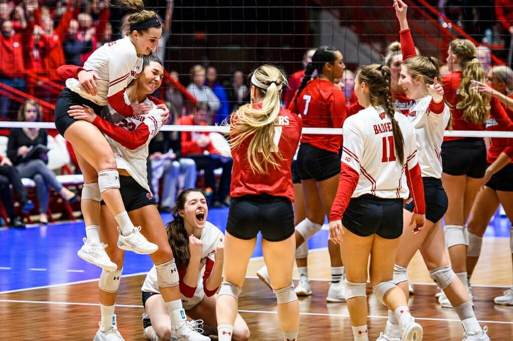 Photo: The Badgers celebrate, second from left, Wisconsin outside hitter Molly Haggerty’s (23) winning point in the the third set.