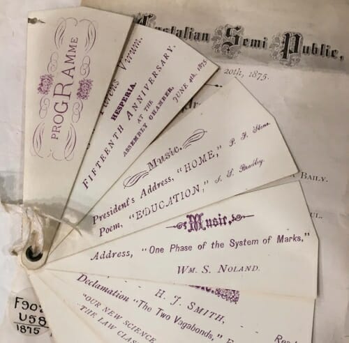 Display of slips of paper with titles of commencement program entries