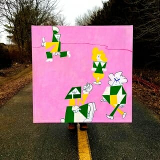 Painting standing on a paved path