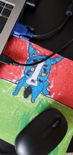 Mouse pad with drawing of blue dog