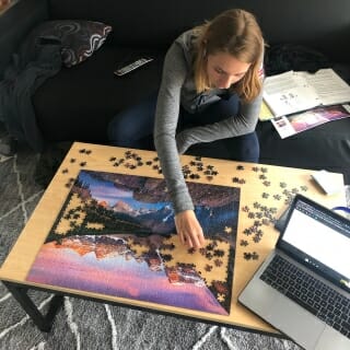 Dani Scholz, a sophomore, fills in puzzle pieces in between classes. 