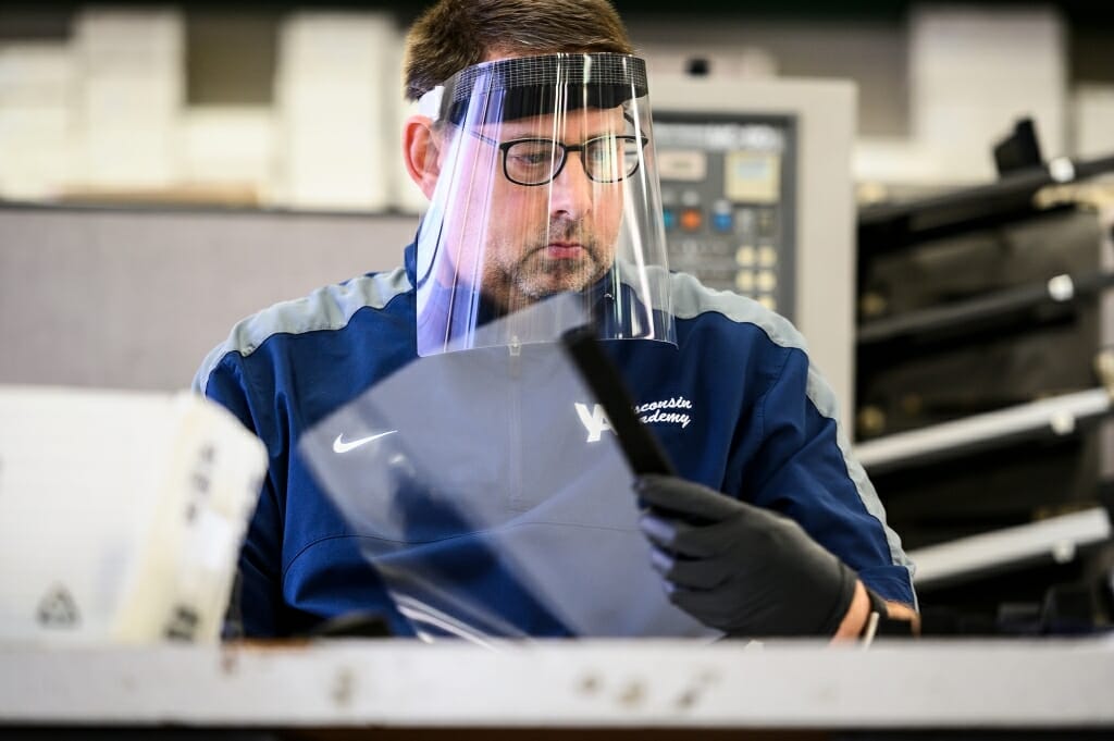 A man with a clear face shield on.