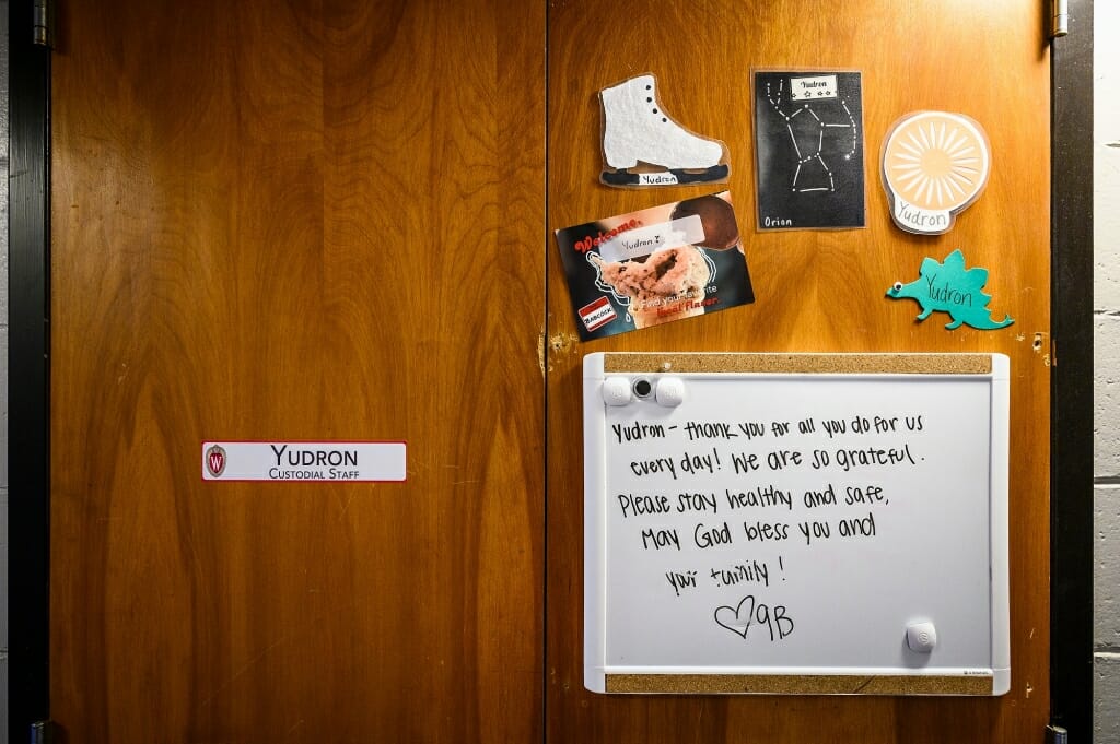 A kind message is written on a white board in a residence hall room.