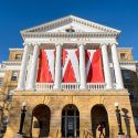 Bascom Hall's pillared front, covered in banners that form a W.