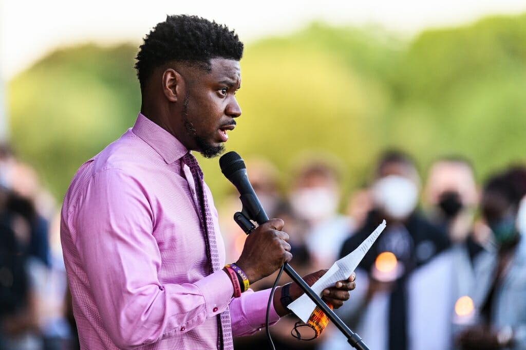 A man speaks into a microphone.