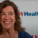 Still from video of Amy Stockhausen in front of a UW Health backdrop