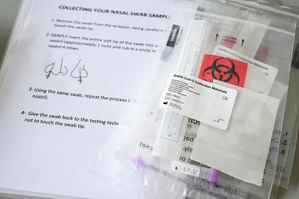 SARS-CoV-2 collection materials await at the testing sites, including illustrated instructions.