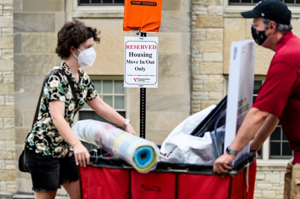 The residence hall move-in scene was a familiar one, but with the added complication of face masks and physical distancing because of the COVID-19 pandemic.