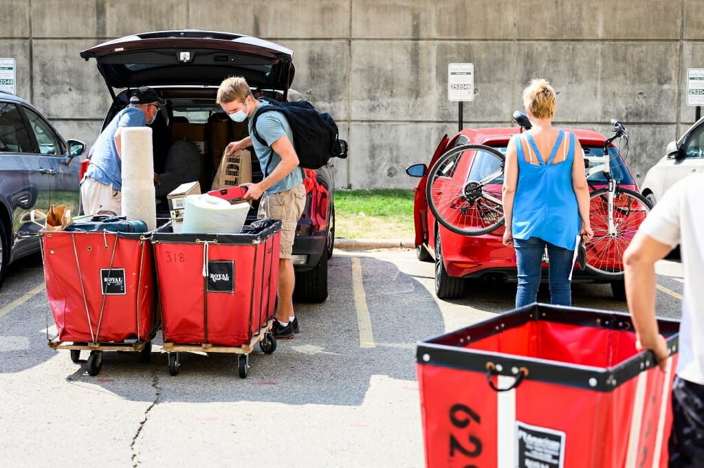 Family members are always willing to lend a hand on move-in day.
