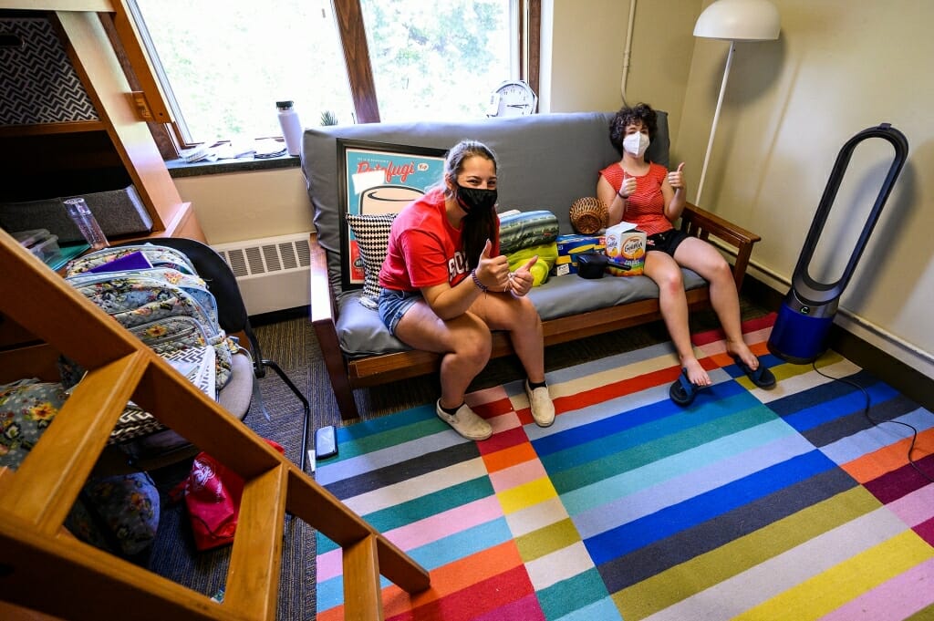 New roommates Maggie Chrostowski, left, from  Hollandale, Wis., and Bella Rosenberg, from Chicago, take a break from unpacking as both women move in to Elizabeth Waters Residence Hall.